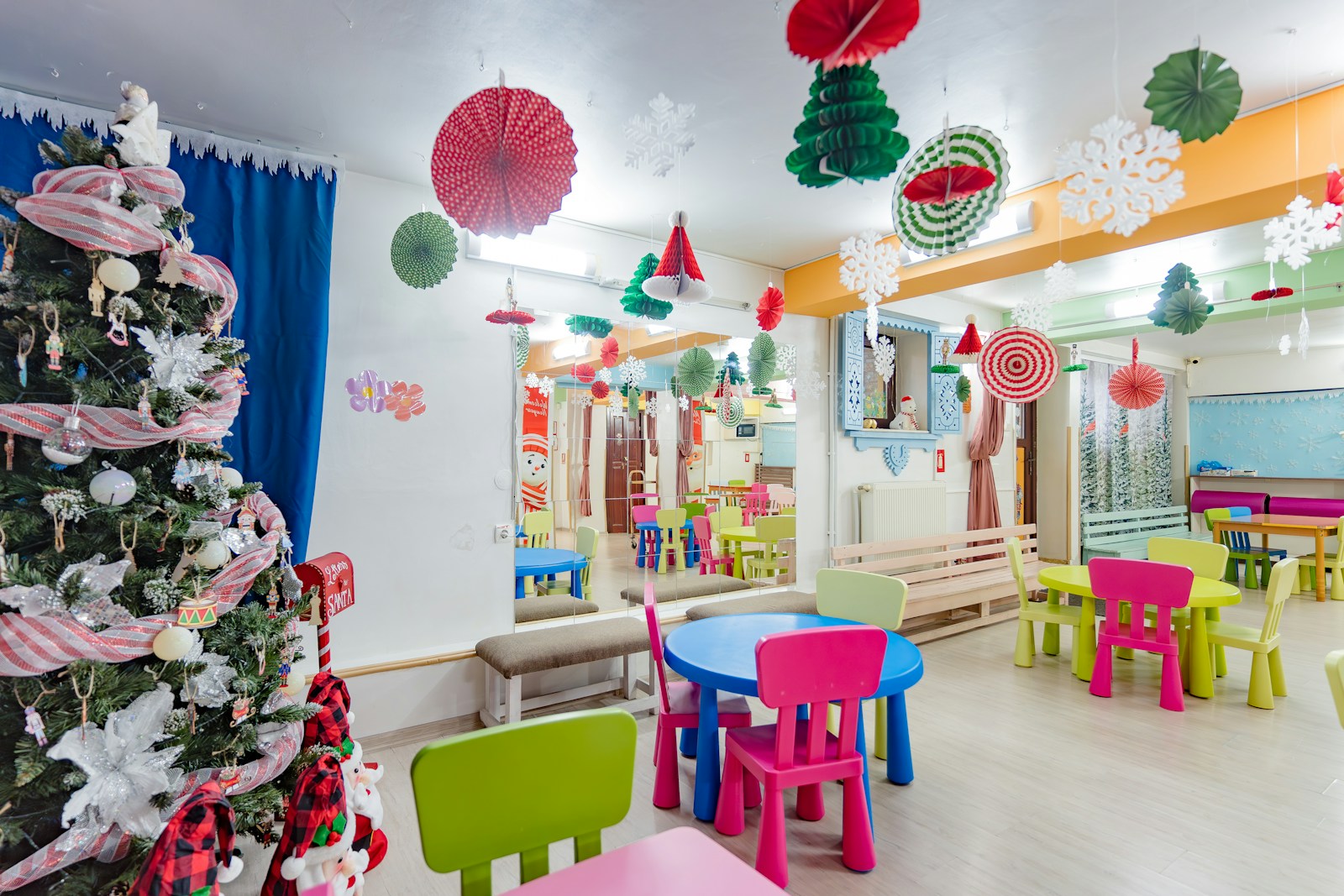 A brightly colored children's room with a christmas tree